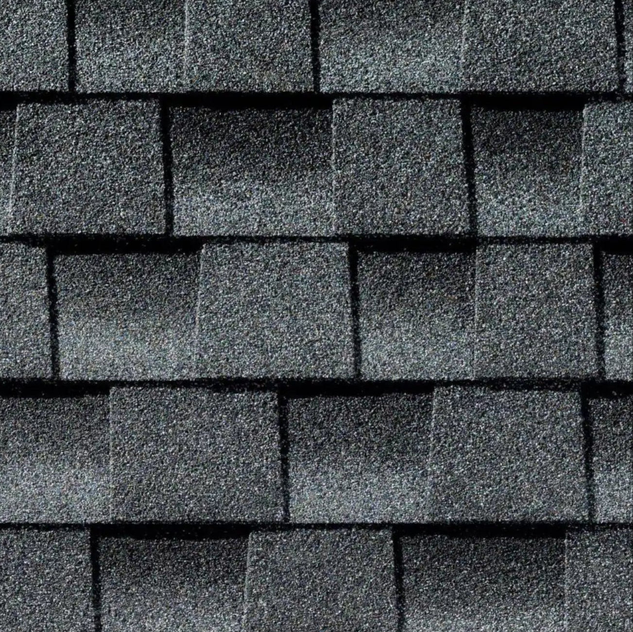 Close-up of GAF Timberline HDZ 33.33 sq. ft. Per Bundle Laminated High Definition Shingles, arranged in an overlapping pattern to show their textured, granular surface and rectangular shapes enhanced by LayerLock Technology.